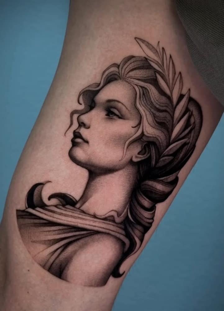 Black and grey realistic portrait tattoo
