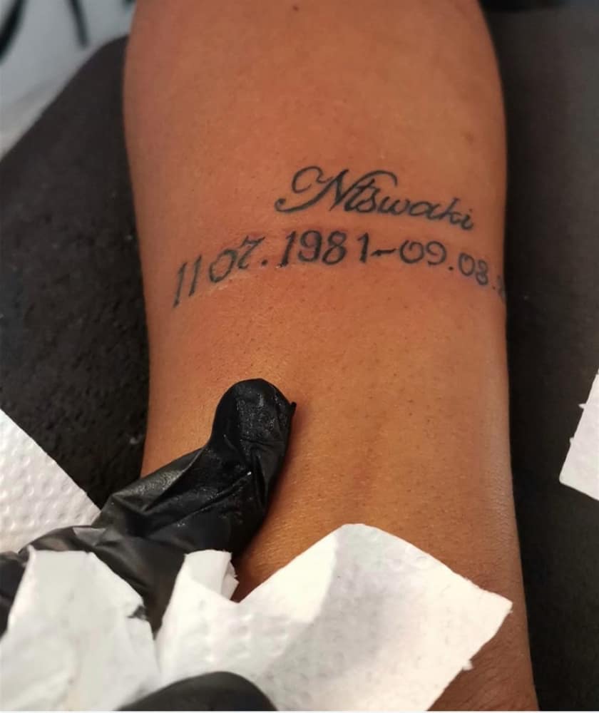 Memorial script name and date lettering tattoo