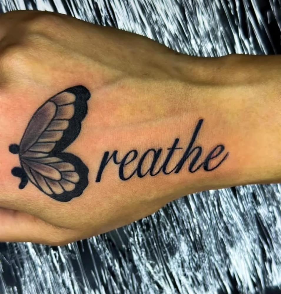 Breathe script tattoo with butterfly semicolon
